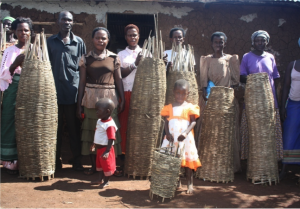HA_Community members with traditional bee hives to be placed in Empaako forests
