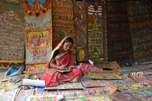 Patua woman   showcasing her work